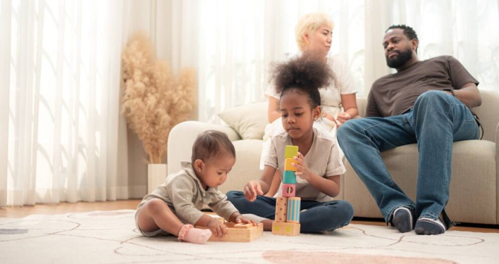 Parents and children relax during their holiday at home