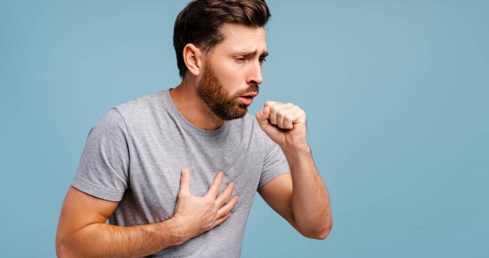 Portrait of sick, upset Hispanic man cough, having virus, cold. Treatment, health care concept