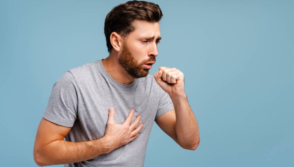 Portrait of sick, upset Hispanic man cough, having virus, cold. Treatment, health care concept